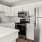 a kitchen with white cabinets