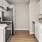 a kitchen with white cabinets