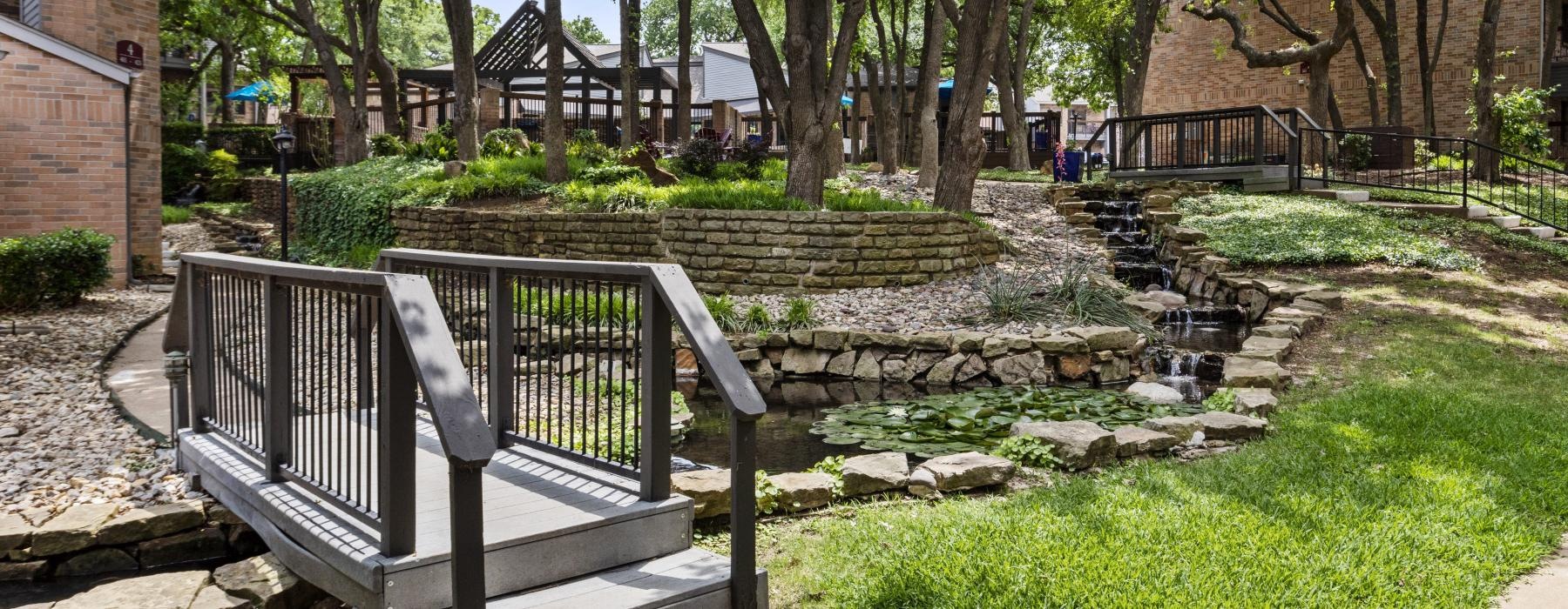 bridge to outside walking path with trees