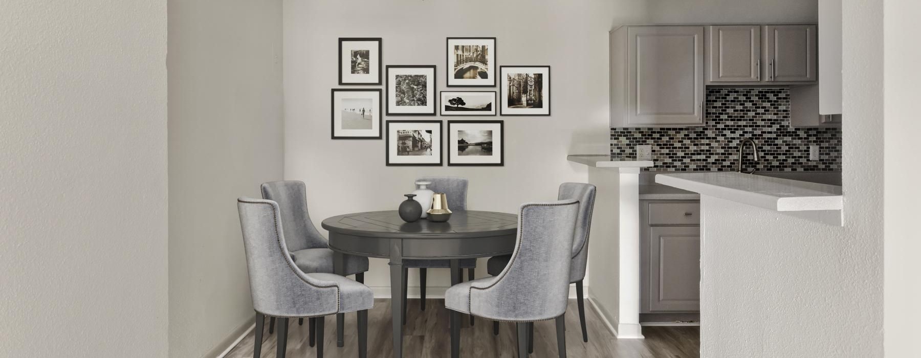 a kitchen with a dining table and chairs