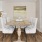 a dining room with a table and chairs