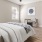 a bedroom with a bed and ceiling fan